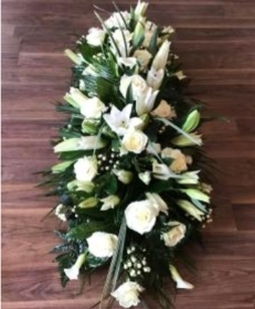 All white lily and rose funeral spray