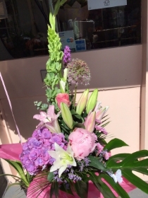 Pink, purple and green tall hand tied bouquet.